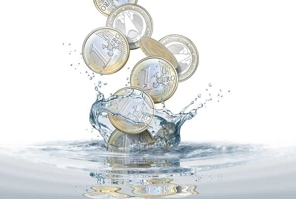 euro coins falling into water