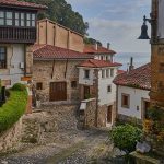 A street with typical homes in Llastres, Asturias, Spain