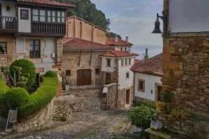 A street with typical homes in Llastres, Asturias, Spain