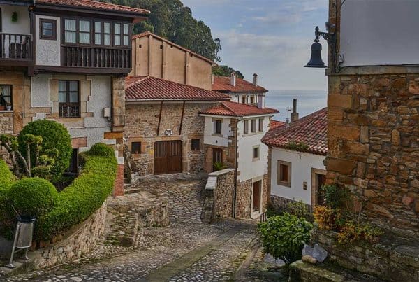 A street with typical homes in Llastres, Asturias, Spain