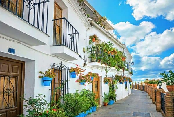 Facade of house with typical floral blue pots in Mijas. Malaga province, Andalusia, Spain