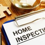 Home Inspections & Building Surveys in Spain: Before You Pay the 10% Deposit Home inspection form with clipboard and pen.